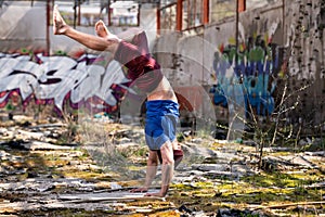 Man Stretch Handstand Exercise in Warehouse