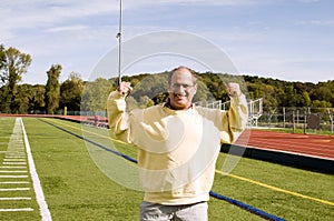 Man stretching exercising sports field