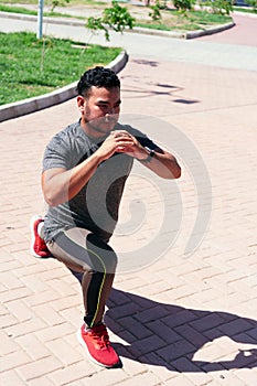 Man stretching his leg and warming up for training