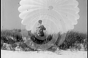 Man struggling with an open parachute