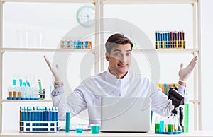 Man student working in chemical lab on experiment