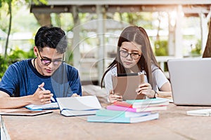 Man students and girlfriend are during reading information