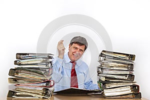 Man studies folder with files at desk in the office