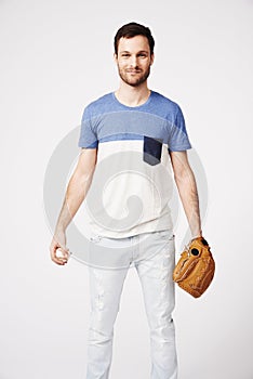 Man, studio and holding baseball with glove for safety, pitch or catch in game, sport or contest by white background
