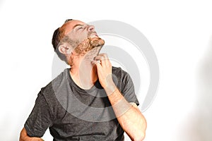 Man in studio overwhelmed, stressed and surprised, model expressions isolating white background