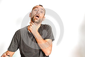 Man in studio overwhelmed, stressed and surprised, model expressions isolating white background