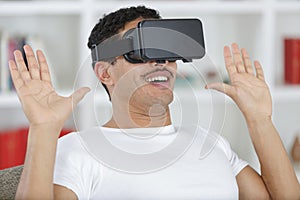 man in studio wearing virtual reality headset playing game