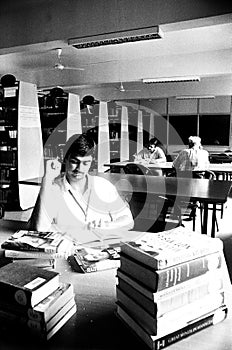 man studying library india