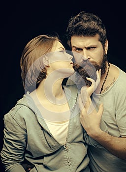 Man with stylish beard. Fashion shot of couple after haircut. Barbershop concept. Woman on mysterious face with bearded