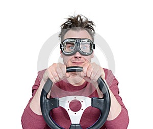 Man in stylish goggles with steering wheel, isolated on white background. Car driver concept