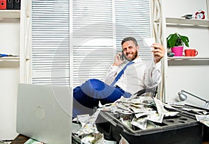 Man successful businessman phone conversation ask service. Businessman rich bearded guy sit office with lot of cash