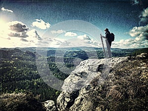 Man on successful hiking, silhouette in mountains