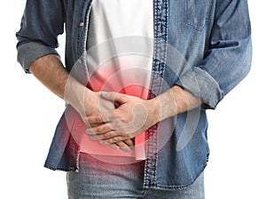 Man suffering from acute appendicitis on white background, closeup