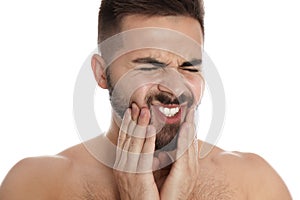 Man suffering from acute toothache on white, closeup