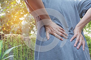 A man suffering from backache, spinal injury and muscle issue problem