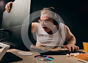Man suffering from computer addiction photo