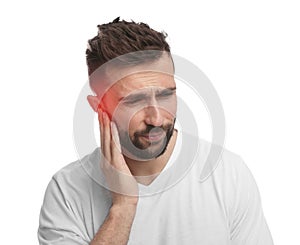 Man suffering from ear pain on white background