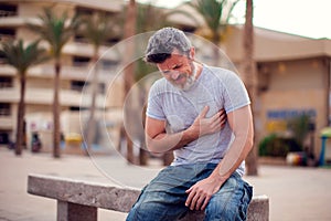 Man suffering from heart attack. People, health care and medicine concept