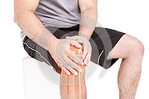 Man suffering with knee inflammation against white background