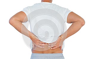 Man suffering from lower back pain photo