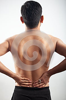 Man suffering from lower spine injury pain