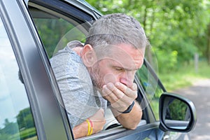 Man suffering from motion sickness