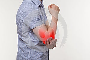 Man suffering from pain in elbow, joint inflammation