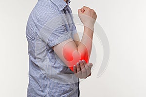 Man suffering from pain in elbow, joint inflammation photo