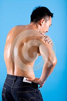 Man suffering from pain on shoulder