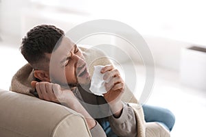 Man suffering from runny nose