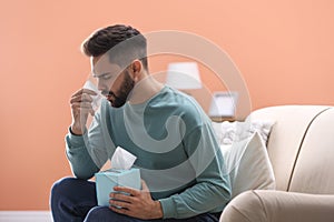 Man suffering from runny nose
