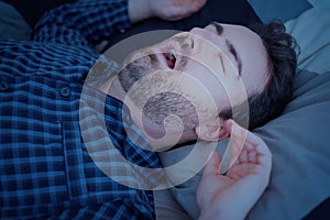 Man suffering for snore disorder during sleep