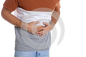 Man suffering from stomach ache on white background, closeup. Food poisoning