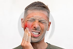 Man suffering from strong tooth pain with red highlighted area. Toothache