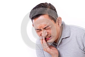 Man suffering from toothache, tooth sensitivity photo