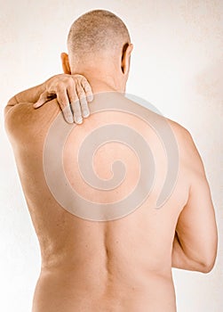 Man suffering of trapezius muscle pain