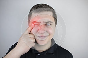 Man suffers from pain in the eye. Patient with ophthalmic disease, uveitis, optic neuritis, conjunctivitis, or eye injury