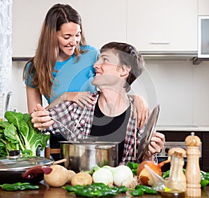 Man suggests to try the cooked food to the girl