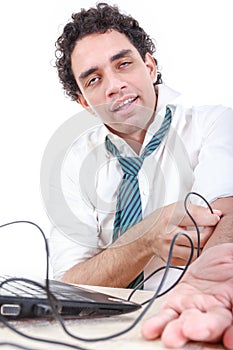 man in suit addicted to internet put USB cable from laptop computer into his arm vein and relaxes