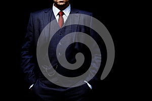 Man in suit on black background photo