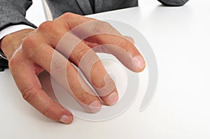 Man in suit drumming his fingers