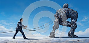 man in suit with engaged in a struggle against an iron giant robot with chain, surreal concept