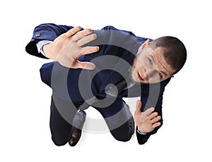 Man in suit evading something on white background, above view