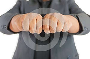 Man with suit fist punch two hands on white