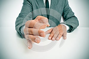 Man in suit gesturing as affirming his speech photo