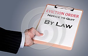 Man in suit giving eviction notice to renter or tenant of home