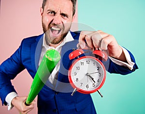 Man suit hold clock in hand and arguing for being late. Business discipline concept. Time management and discipline