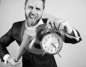 Man suit hold clock in hand and arguing for being late. Business discipline concept. Time management and discipline