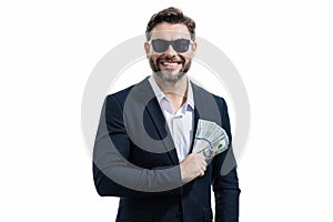 Man in suit holding cash money in dollar banknotes on isolated white background. Studio portrait of businessman with