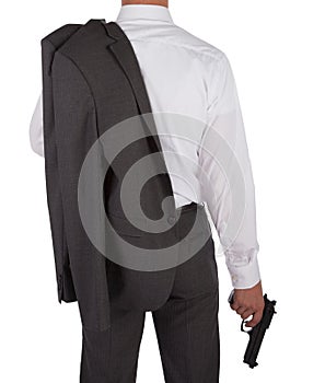 Man in a suit holding a gun